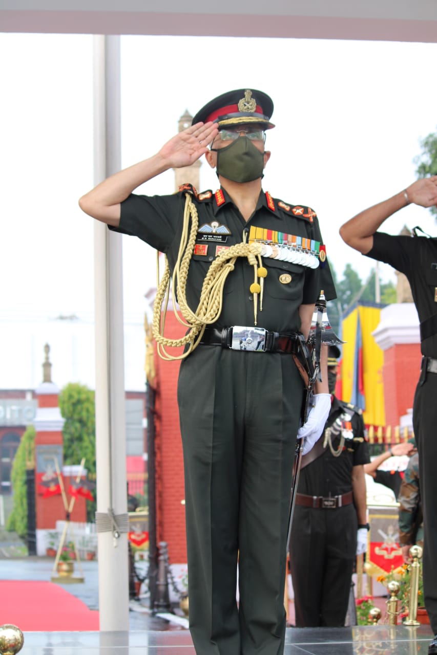 General MM Naravane, PVSM, AVSM, SM, VSM, ADC, Chief Of Army Staff, Reviewing Officer, saluting the IMA Colour...